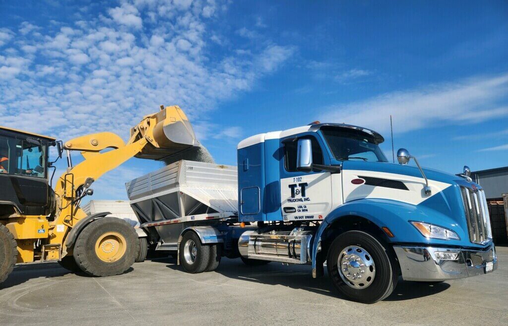 Bottom Dump Truck being loaded with powder